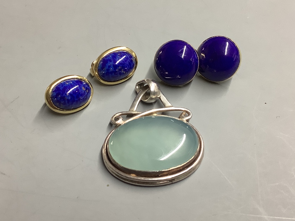 A pair of 18ct gold and lapis lazuli cabochon stud earrings, gross 7.4 grams, a pair of Dior earrings and an oval hardstone pendant